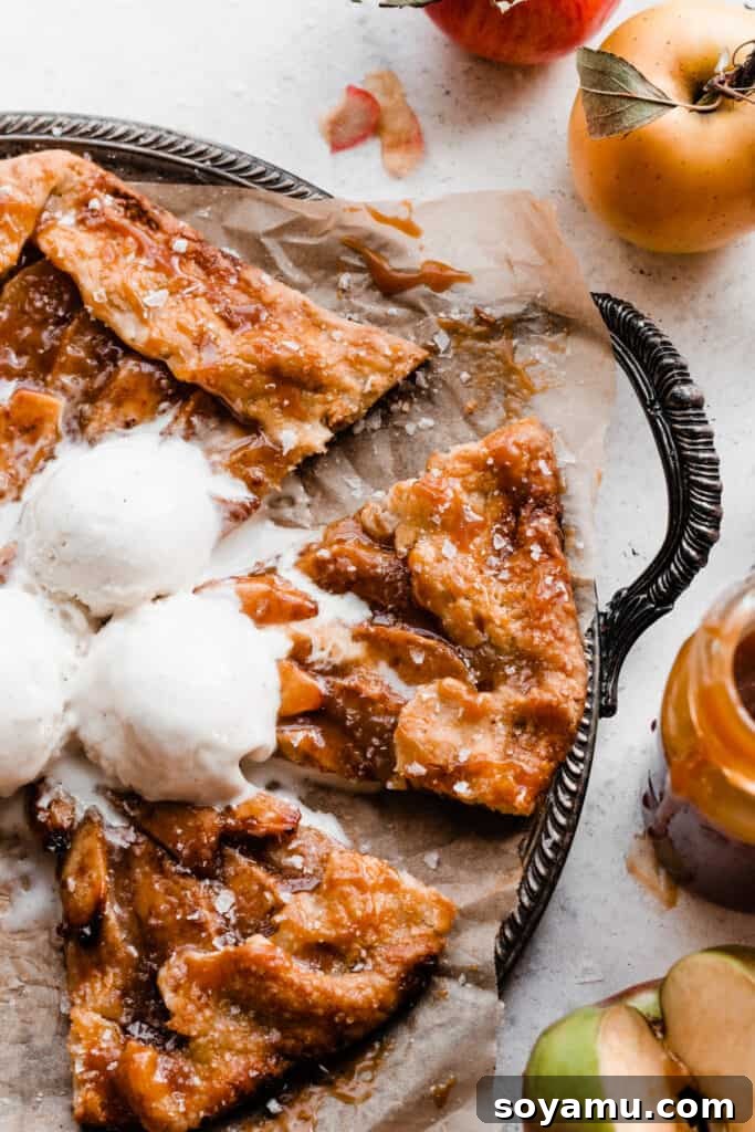Salted Caramel Apple Galette Recipe 9 A tantalizing close-up shot of a single slice of Salted Caramel Apple Galette, revealing its perfectly baked, flaky crust, tender apple filling, and generous caramel drizzle.