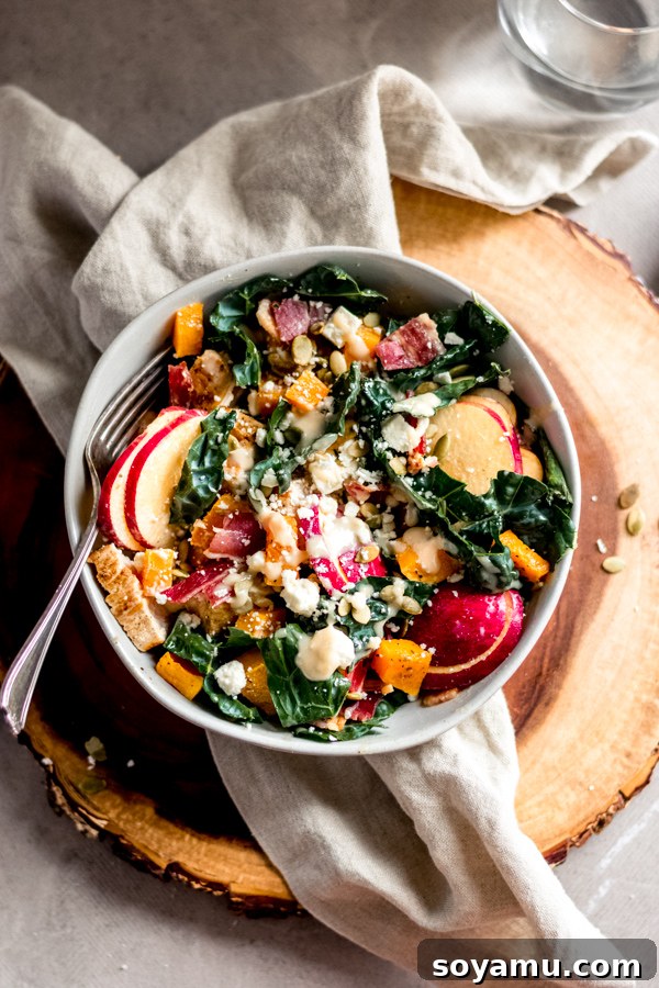 Autumns Best Apple Recipes Fresh from the Orchard 10 A generous bowl of Fall Harvest Salad, showcasing a colorful mix of kale, apples, squash, and chicken.