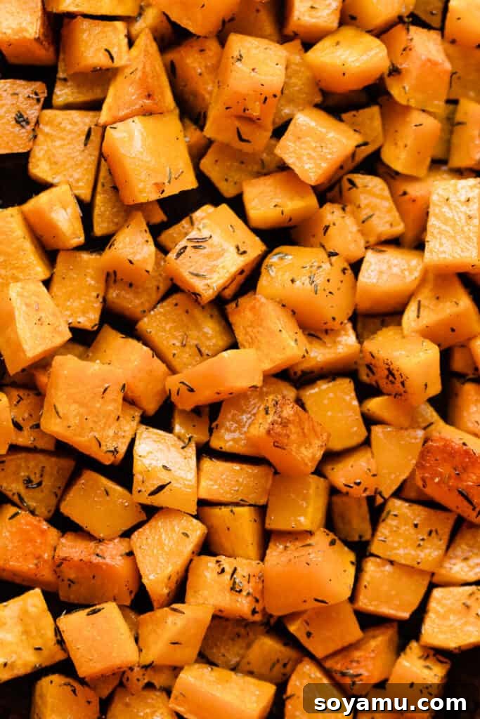 Asiago Parmesan Butternut Squash Galette 4 A close-up image of seasoned butternut squash cubes, roasted to a golden-brown hue, ready for the galette.