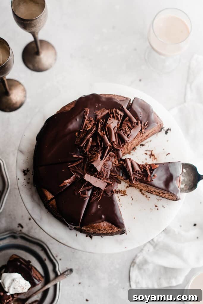 Baileys Infused Chocolate Ganache Cheesecake 10 A top-down view of the smooth, dark chocolate ganache-topped Baileys chocolate cheesecake.