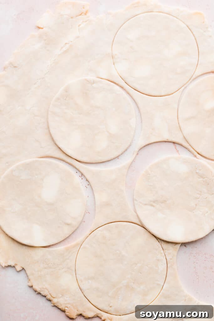Salted Caramel Peach Mini Pies 5 Pie dough circles cut out of the pie dough.