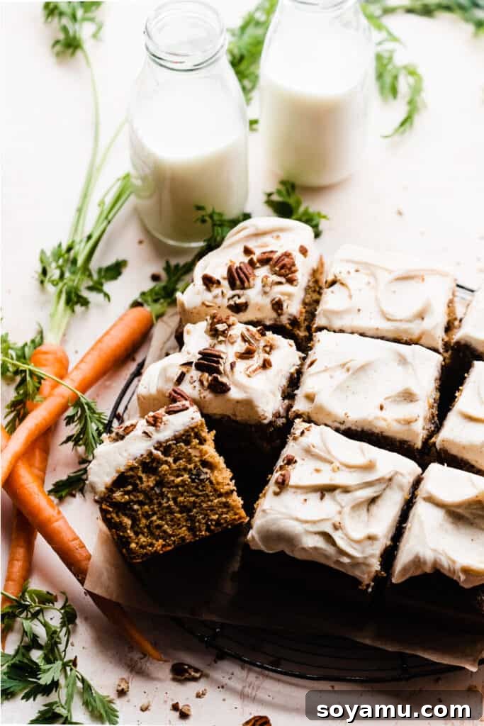 Caramelized Brown Butter Mini Carrot Cakes 2 A beautifully sliced carrot sheet cake, generously topped with creamy brown butter cream cheese frosting and sprinkled with chopped pecans, served alongside two bottles of refreshing milk.