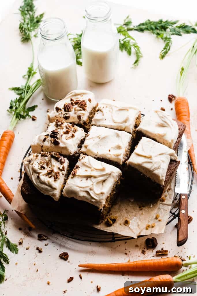 Caramelized Brown Butter Mini Carrot Cakes 12 The full, sliced carrot cake, exquisitely topped with crushed pecans, arranged on a rustic wooden board and surrounded by fresh carrots and charming bottles of milk.