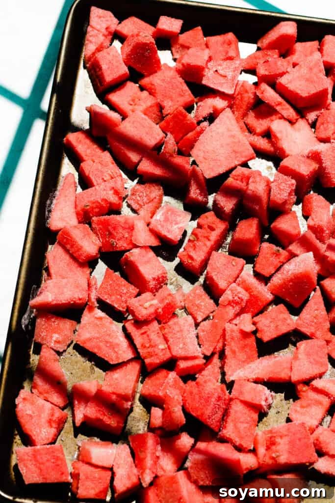 Watermelon Wave Frozen Margaritas 4 A sheet pan full of frozen watermelon chunks.