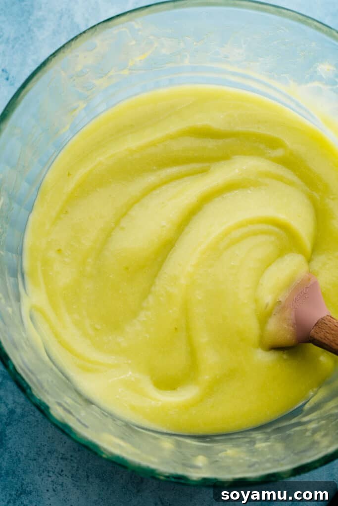 Zesty Mojito Cake with Spiked Rum Buttercream 4 A bowl of vibrant, freshly made lime curd.