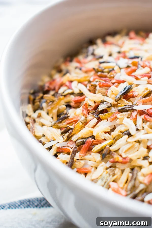 A close-up view of the healthy chicken wild rice casserole, showcasing the vibrant butternut squash and texture of wild rice.