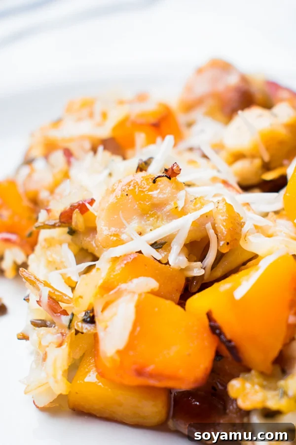 A vibrant bowl of healthy chicken wild rice casserole, garnished with fresh herbs, ready to be served.