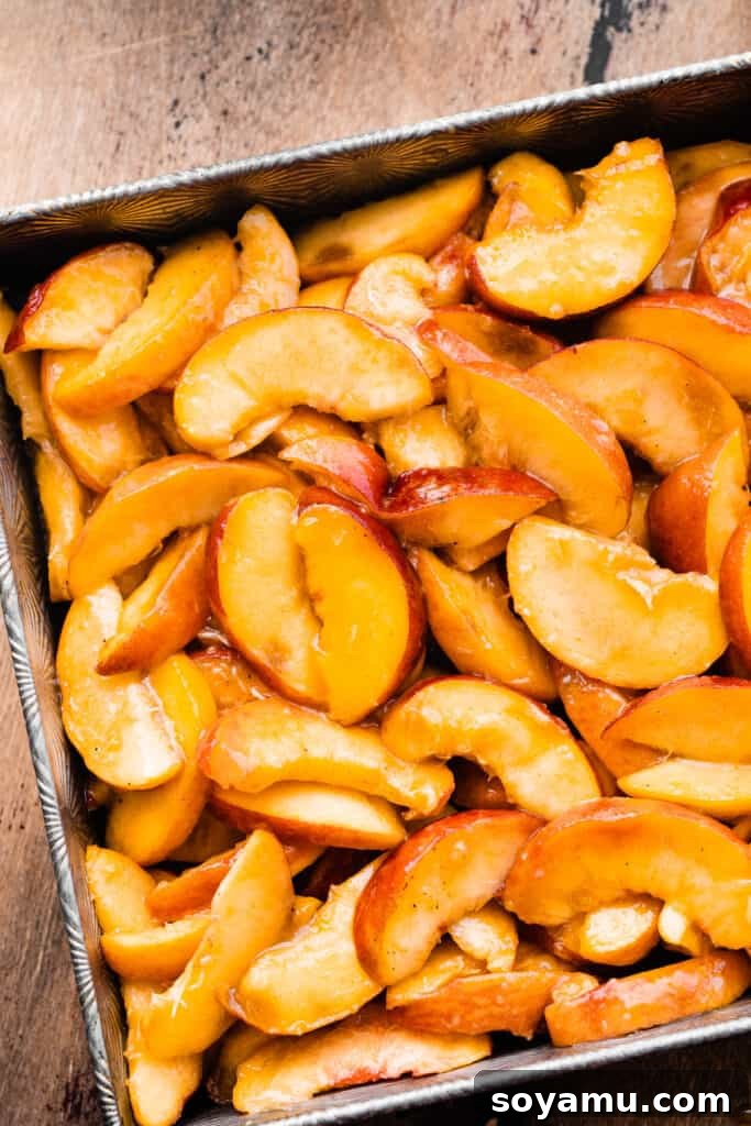 Easy Peachy Cobbler Bake 4 Sliced peaches in the baking dish.