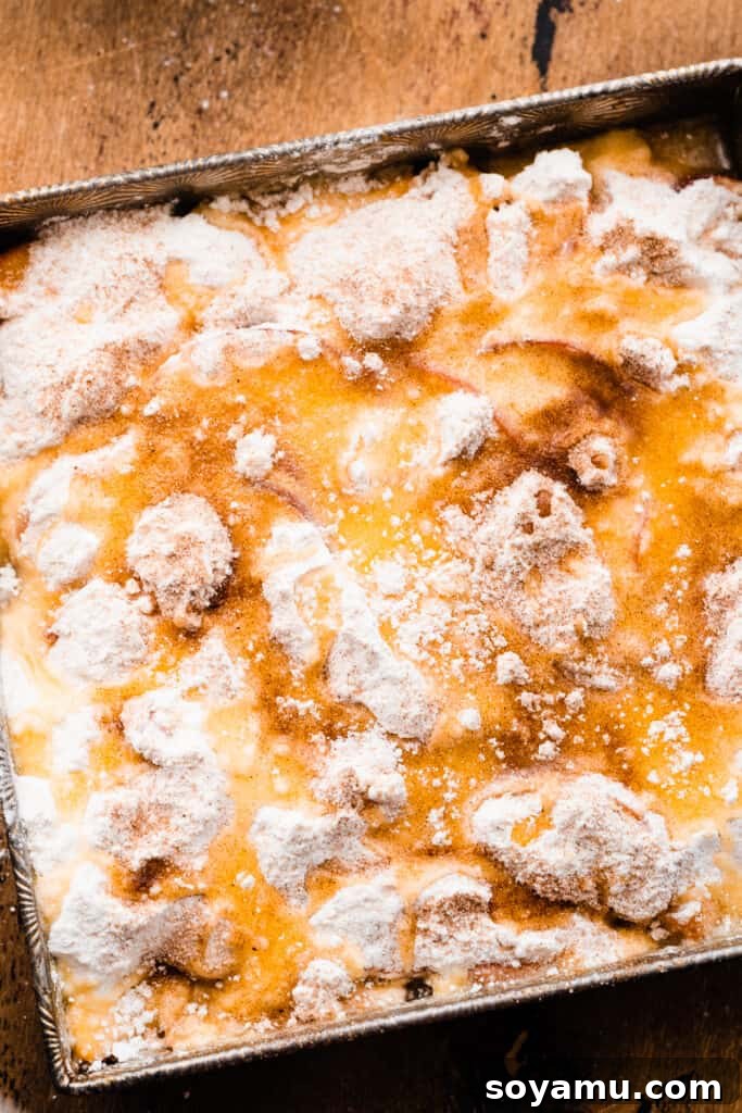 Easy Peachy Cobbler Bake 6 Melted butter poured over the cake mix and sprinkled with cinnamon sugar.