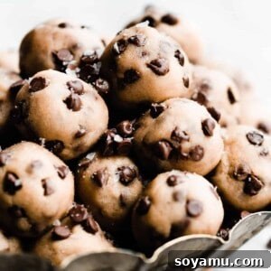 Mini no bake cookie dough bites piled in a metal tray.