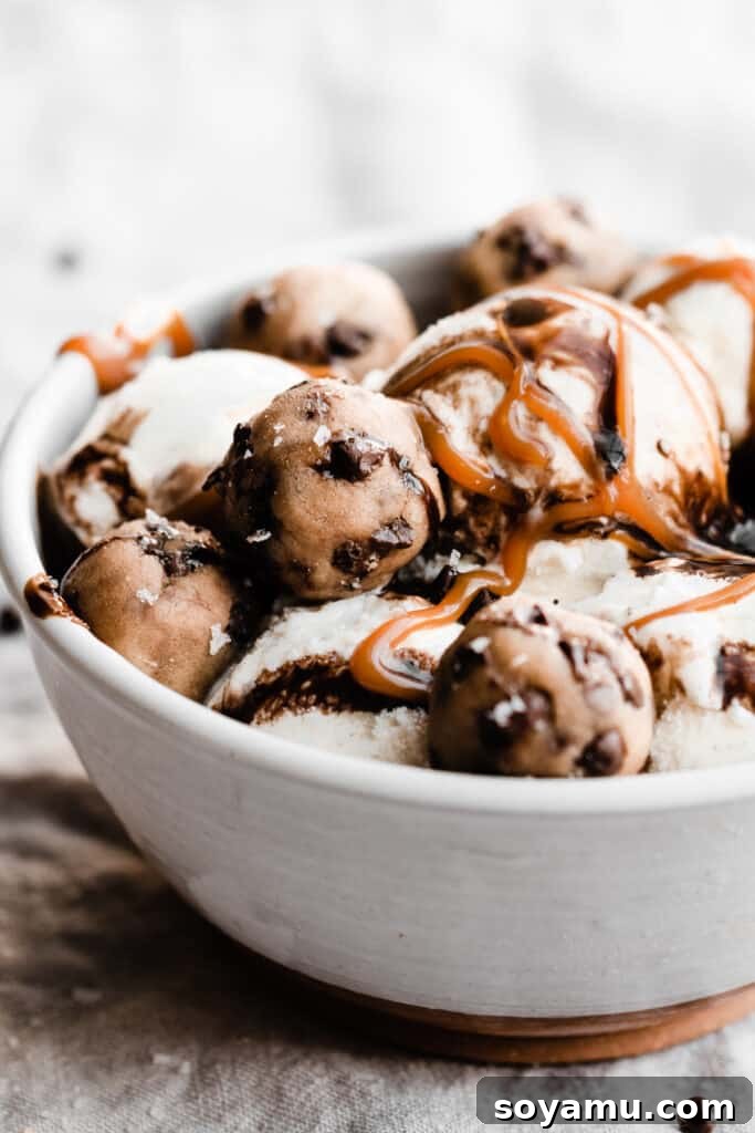 No-Bake Cookie Dough Poppers 8 A bowl of vanilla ice cream generously topped with creamy caramel sauce, rich chocolate sauce, and irresistible edible cookie dough bites.