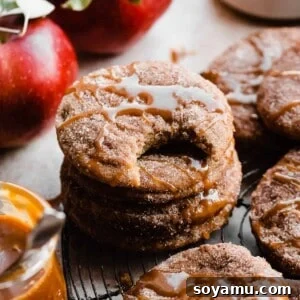 A stack of cinnamon-coated caramel-drizzled apple cider cookies.