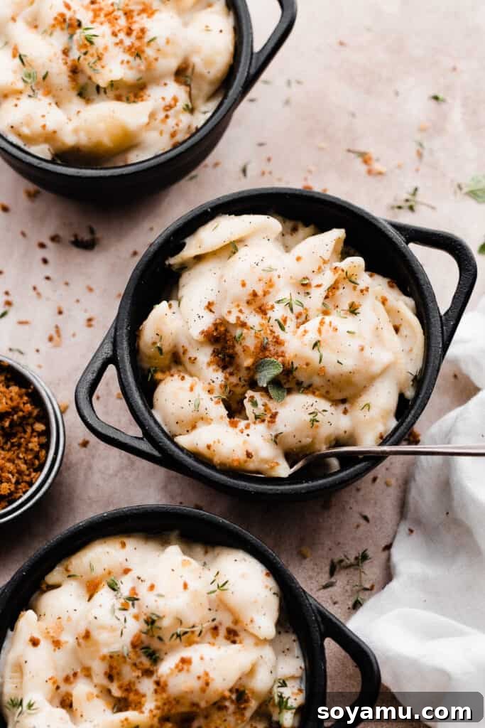Creamy White Cheddar Mac with Crispy Brown Butter Crumbs 3 Two bowls of perfectly portioned white cheddar mac and cheese, topped generously with golden brown butter breadcrumbs.