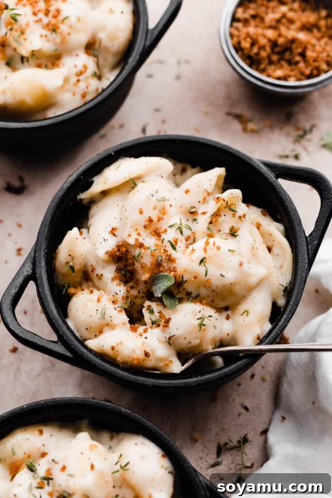 Creamy White Cheddar Mac with Crispy Brown Butter Crumbs 9 A close-up on a single bowl of rich, creamy white cheddar mac and cheese, ready to be enjoyed.