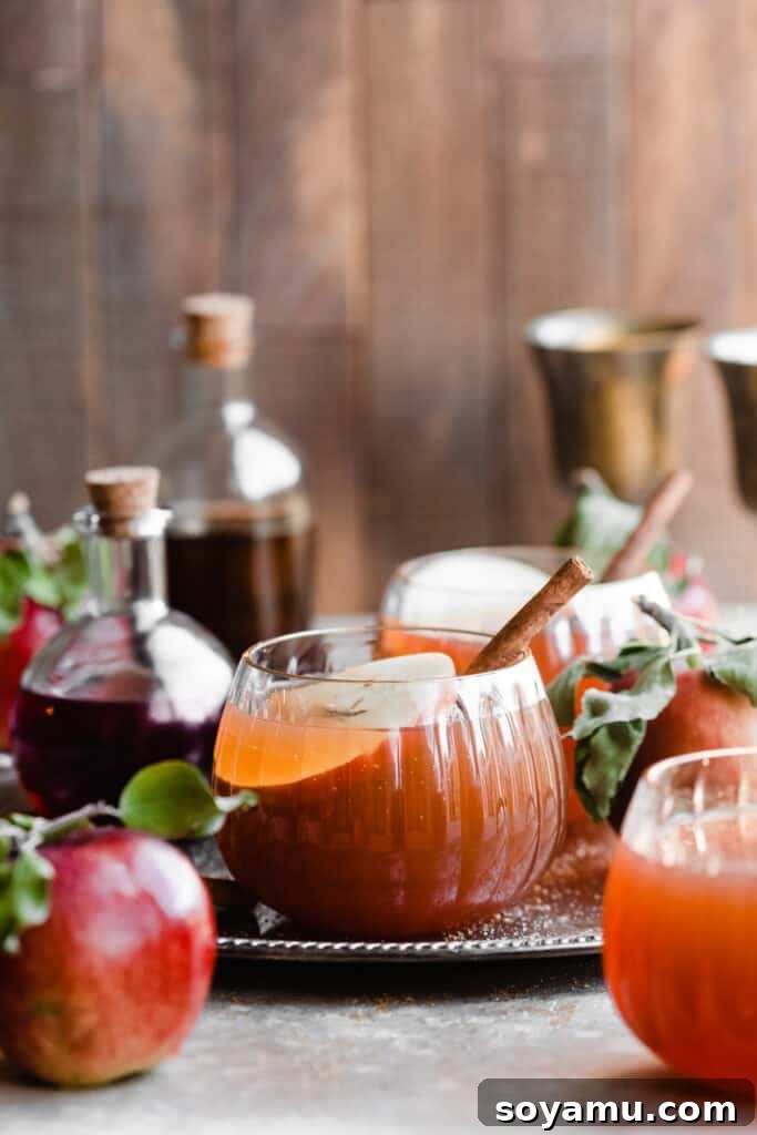 Glasses of the cocktail on a vintage metal tray with a wooden backdrop.