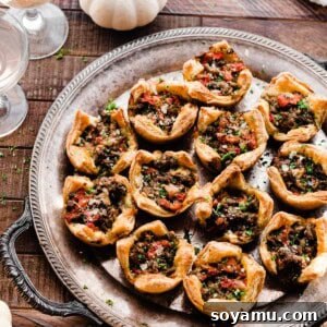 A beautifully presented serving of Lamb Appetizer Cups with Roasted Peppers & Pesto.
