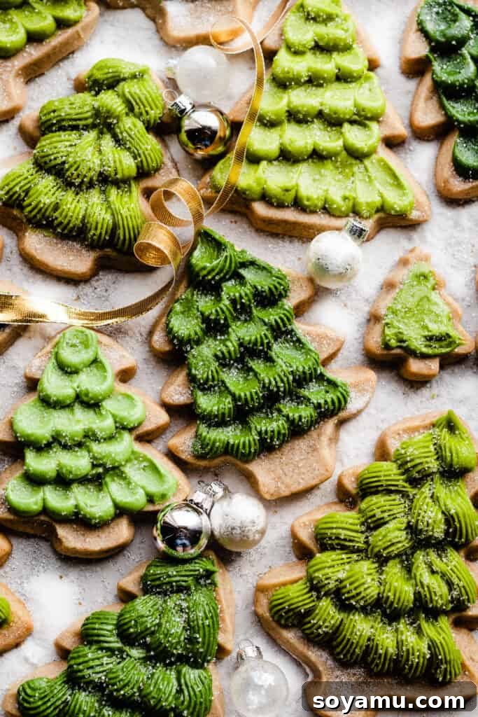 Honey Cream Dream Cookies 10 Honey cookies decorated like christmas trees on a sugary surface, with christmas ribbon and ornaments.