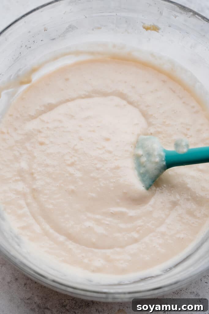 Pink Champagne Raspberry Delights 4 A bowl of light and airy vanilla cupcake batter, ready to be baked into delicious treats.