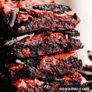 Stack of 5 fudgy red velvet oreo brownies.