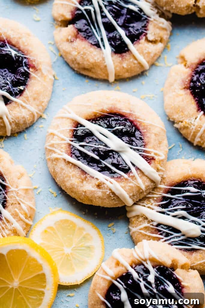 Blueberry sauce filled lemon thumbprint cookies, showcasing another creative use for the sauce.