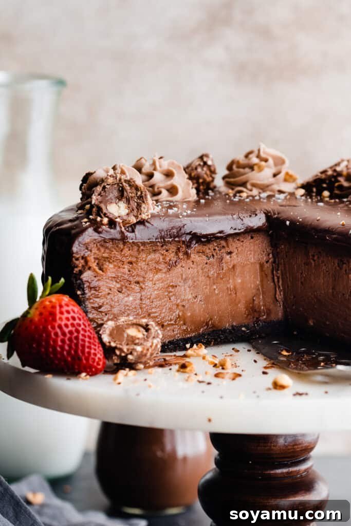 A close-up of a cross section of the sliced cheesecake, showing its rich layers.
