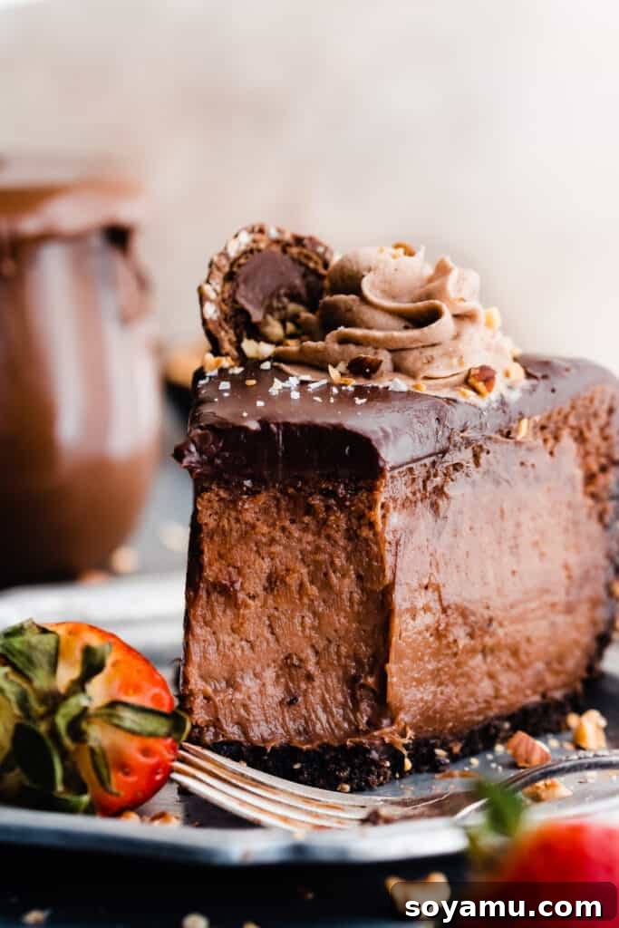 A close-up on a slice of nutella cheesecake with a bite missing, showing its creamy texture.