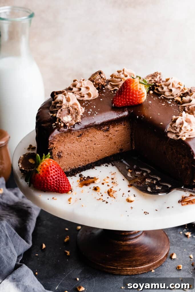 A 3/4 view of the sliced cheesecake, showing its height and topping.