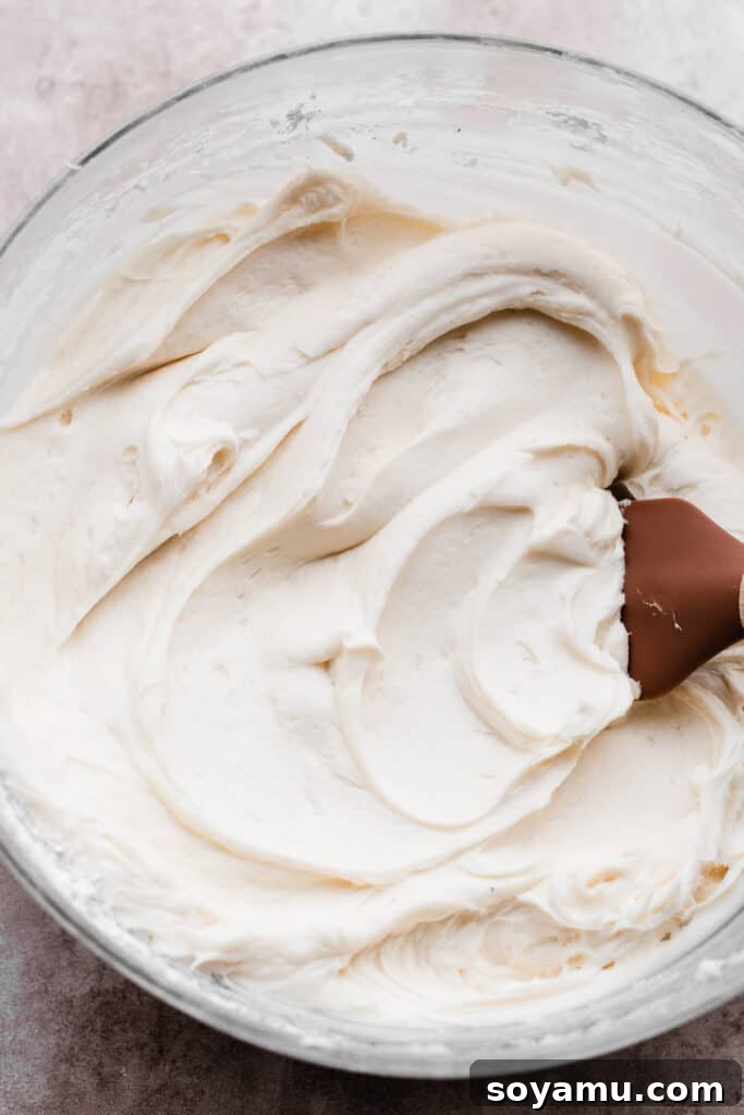 Piña Colada Dream Cake 8 A bowl of creamy frosting.