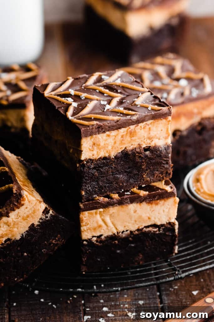 Buckeye Bliss Brownies 10 A visually appealing 3/4 view of a stack of richly layered Buckeye brownies, emphasizing their height and delicious composition.