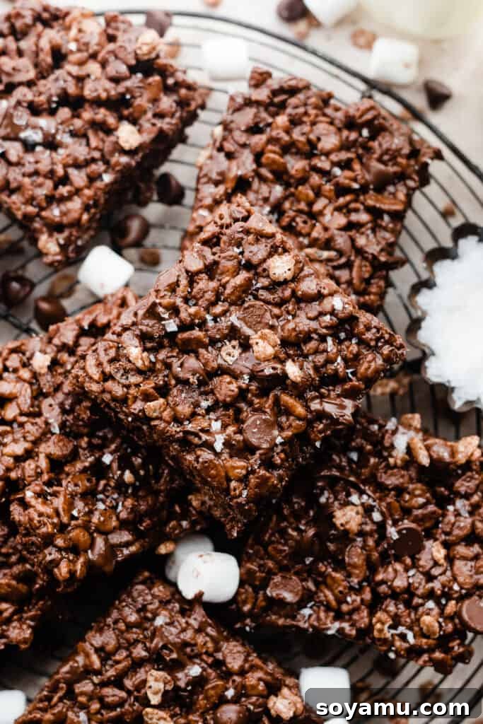 Perfectly sliced brown butter chocolate rice krispie treats on a vintage serving rack, ready to enjoy.