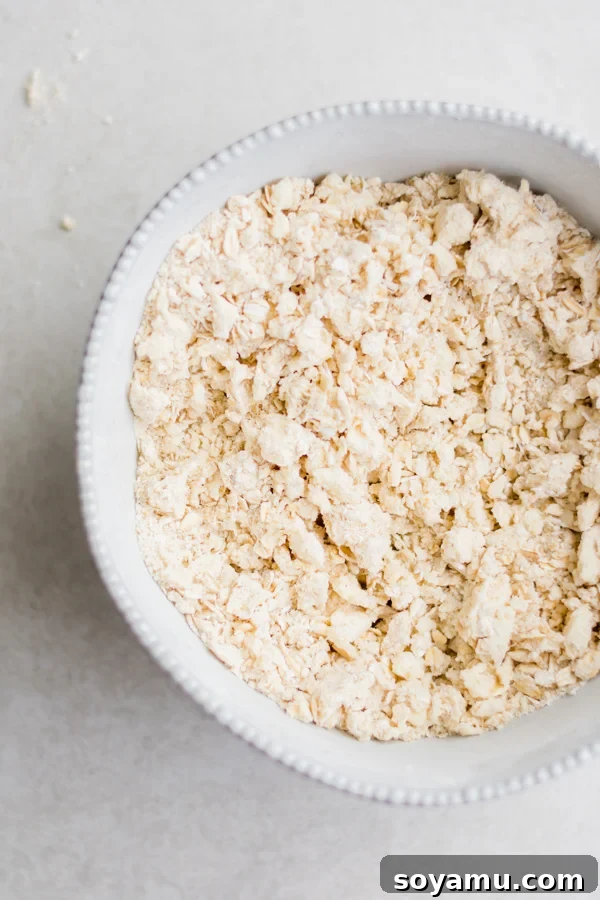 Close-up of the delicious, buttery oat crumble topping, perfectly mixed and ready to be sprinkled over fruit.