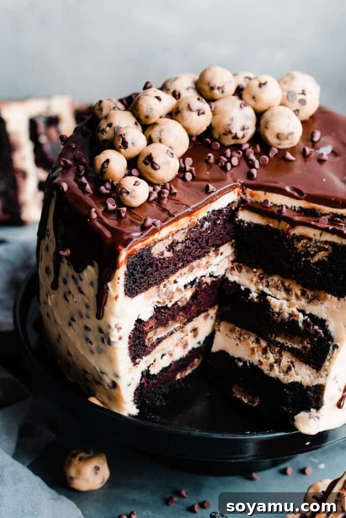 Decadent Cookie Dough Cake 12 A 3/4 close-up of the cookie dough cake, sliced open.