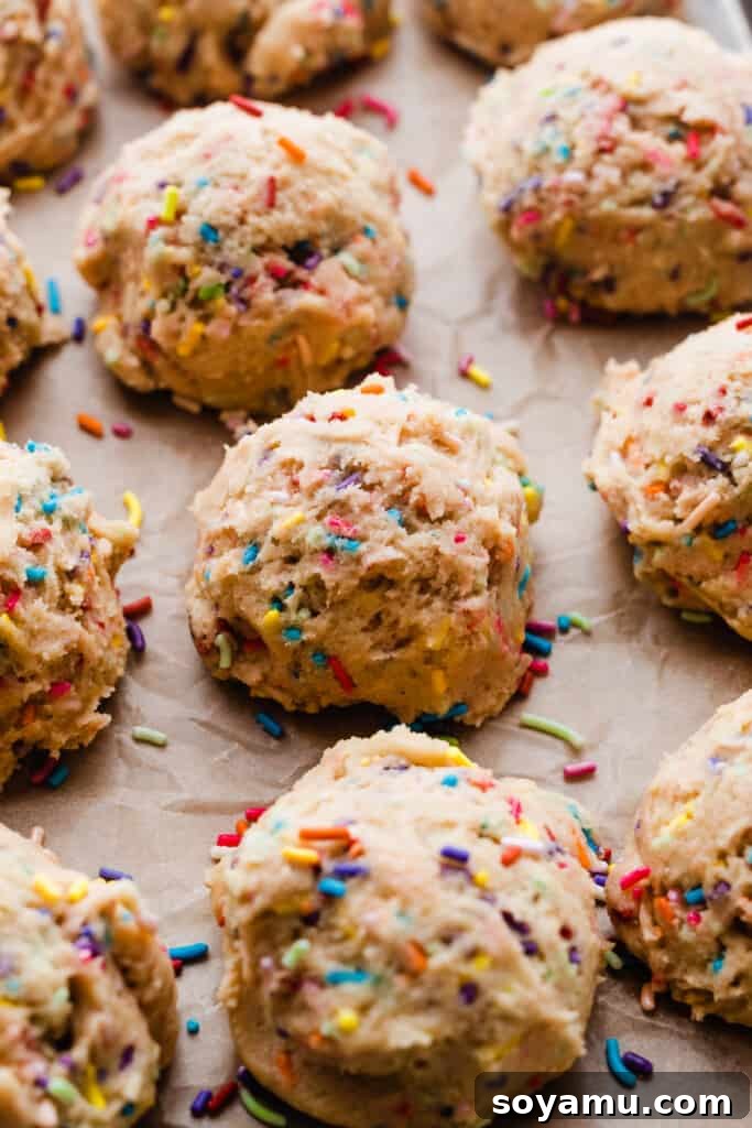 Irresistible Funfetti Cookies with a Cake Batter Cheesecake Surprise 5 Perfectly scooped balls of funfetti cookie dough, neatly arranged and ready for their extended chilling period.