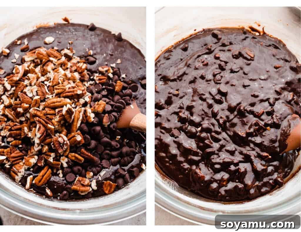 Irresistible Turtle Brownies 5 A bowl of brownie batter with chocolate chips and pecans being mixed in.
