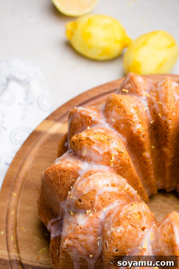 A close-up of the moist interior of the Lemon Poppy Seed Bundt Cake with glaze