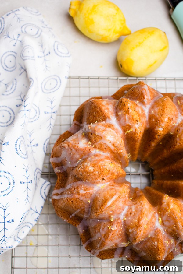 Lemon Poppy Seed Bundt Cake topped with a lemon glaze and fresh lemon zest