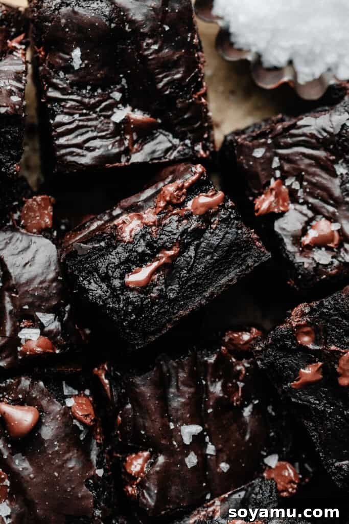 Ultra Fudgy Gluten Free Brownies 2 A close-up on the sliced gluten-free brownies, with some facing upwards to show their fudgy insides, revealing rich chocolate and a dense, chewy texture.