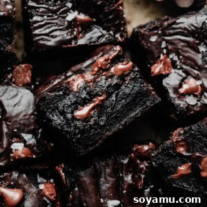 An overhead view of the sliced brownies, with the shiny tops and fudgy insides visible.