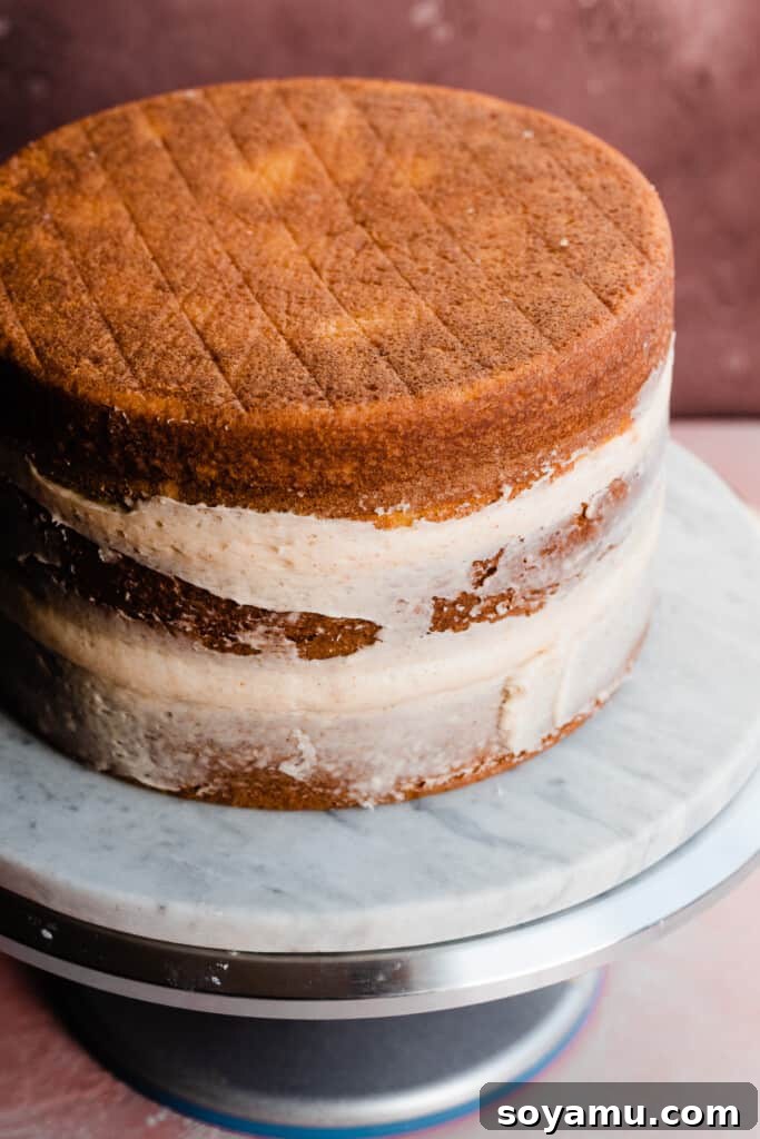 Decadent 8-inch Vanilla Cake with Golden Brown Butter Frosting 8 The stacked and partially crumb coated cake layers.