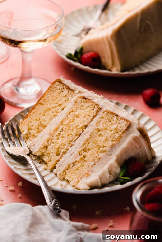 Decadent 8-inch Vanilla Cake with Golden Brown Butter Frosting 10 A slice of the 8-inch cake on a plate.