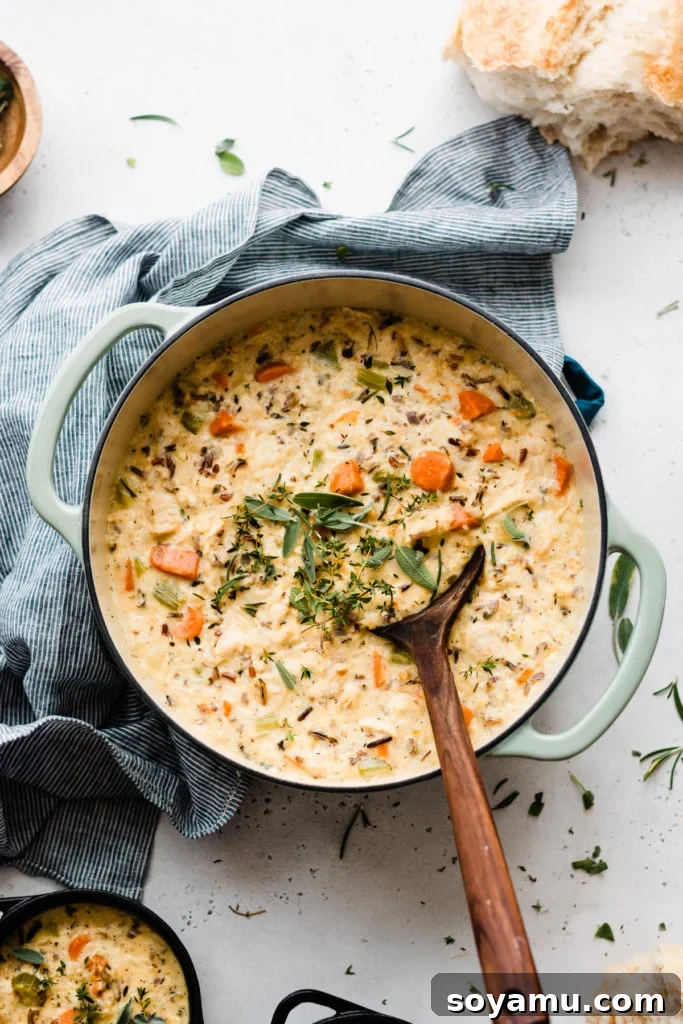 Soulful Chicken Wild Rice Soup 8 A large Dutch oven filled to the brim with the hearty and delicious chicken wild rice soup, ready to be served.