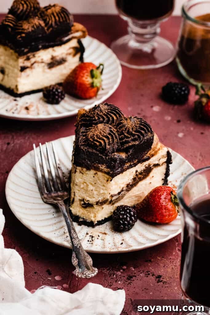 Decadent Mocha Tiramisu Cheesecake 14 Several plates with individual slices of Tiramisu Cheesecake, artfully presented and ready to be enjoyed.