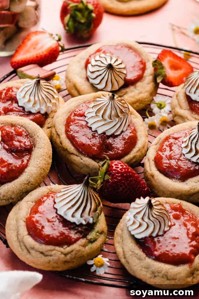 A delectable spread of strawberry rhubarb pie cookies arranged on a vintage wire rack, ready for serving.