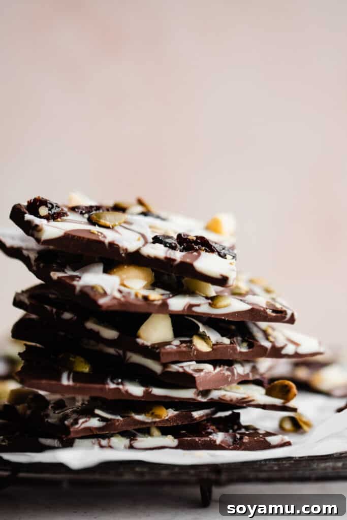 Easy Five-Ingredient Homemade Chocolate Bark 8 A close-up view of a beautifully textured stack of homemade chocolate bark, ready to be enjoyed.