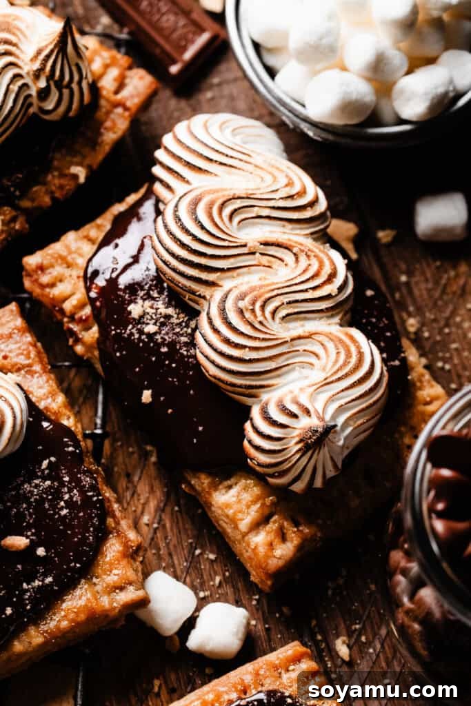 A close-up of a s'mores pop tart on a rustic wooden background, highlighting its texture and inviting appearance.