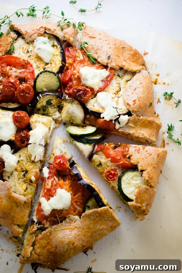 Rustic Mixed Vegetable Galette on a wooden board, showcasing a golden crust and vibrant vegetable filling.