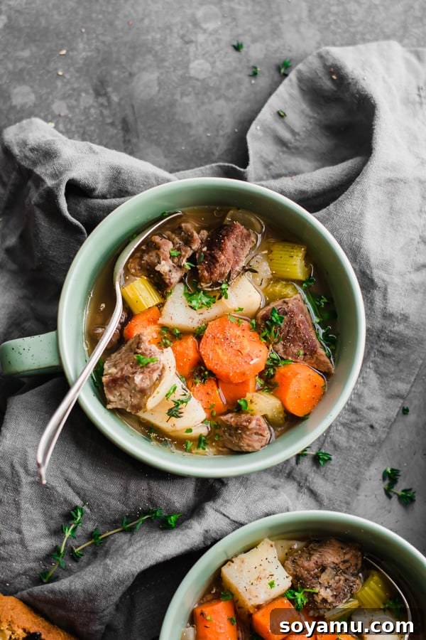 Irish stew served in bowls alongside a loaf of freshly baked Irish soda bread.