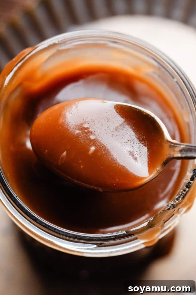 Whip Up 10-Minute Golden Butterscotch 9 A close-up on a spoonful of butterscotch sauce.