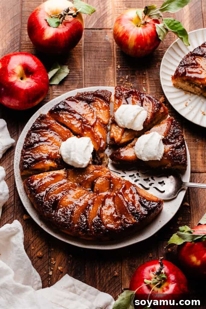 Sticky Apple Caramel Cake 9 A slice of the glorious apple upside down cake on a white plate, invitingly presented.