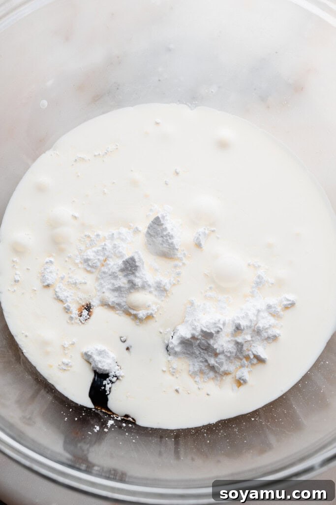 Whip Up Perfect Homemade Cream 4 A bowl containing all the cold ingredients for homemade whipped cream before mixing.